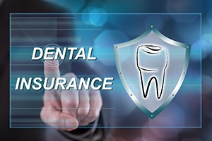 Man tapping electronic screen reading Dental Insurance