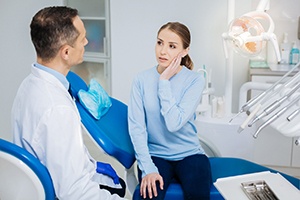 Woman visiting dentist with a dental emergency in Lakewood
