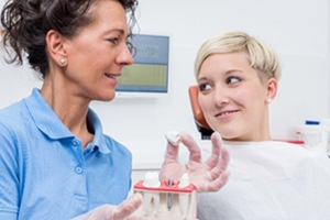 Lakewood implant dentist discussing dental implants with patient