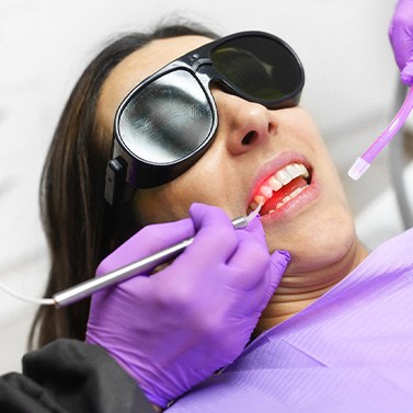 A woman getting laser periodontal treatment