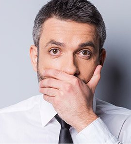Man covering mouth
