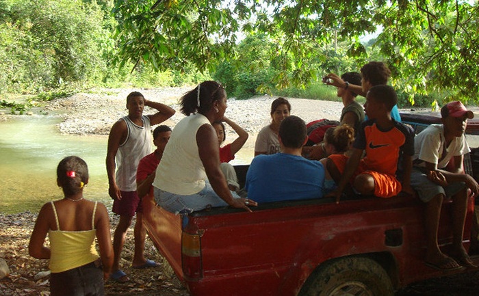 Group of people in truck on mission trip