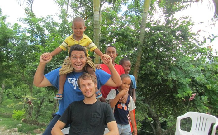 Dr. Artino giving child a piggy back ride