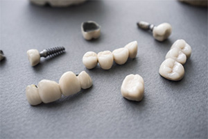A pile of dental restorations resting on a table.