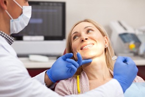 Woman at consultation for cosmetic dental bonding in Lakewood
