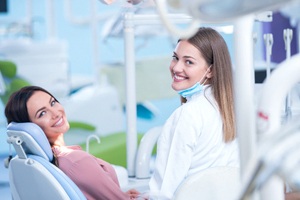 Woman in dental chair for cosmetic bonding