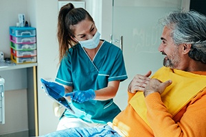 a patient speaking with a dental hygienist
