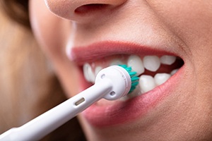 Close-up of woman brushing her teeth