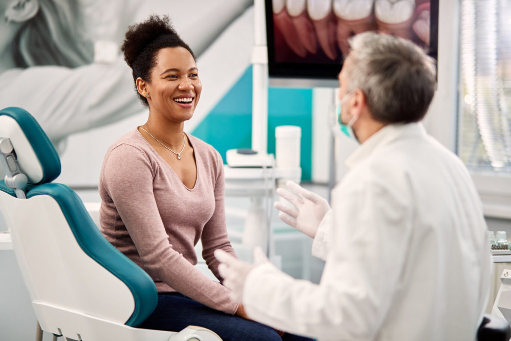 patient learning about the benefits of porcelain veneers in Lakewood