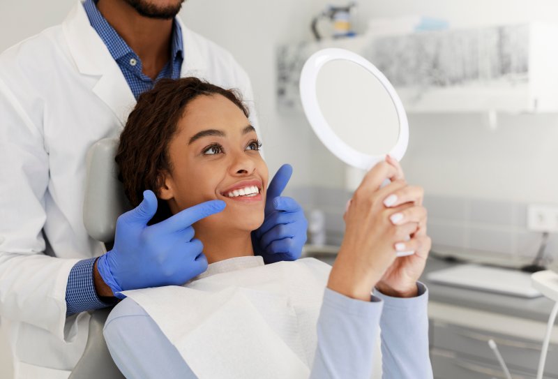 a patient maintaining her veneers in Lakewood