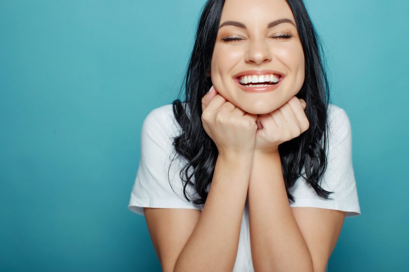 Lady smiles with pretty teeth