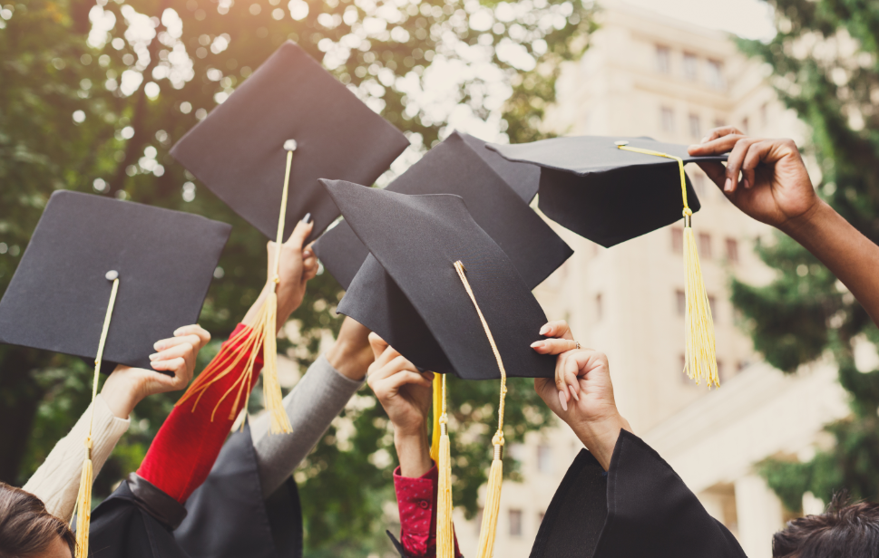 Picture of graduation caps in the air